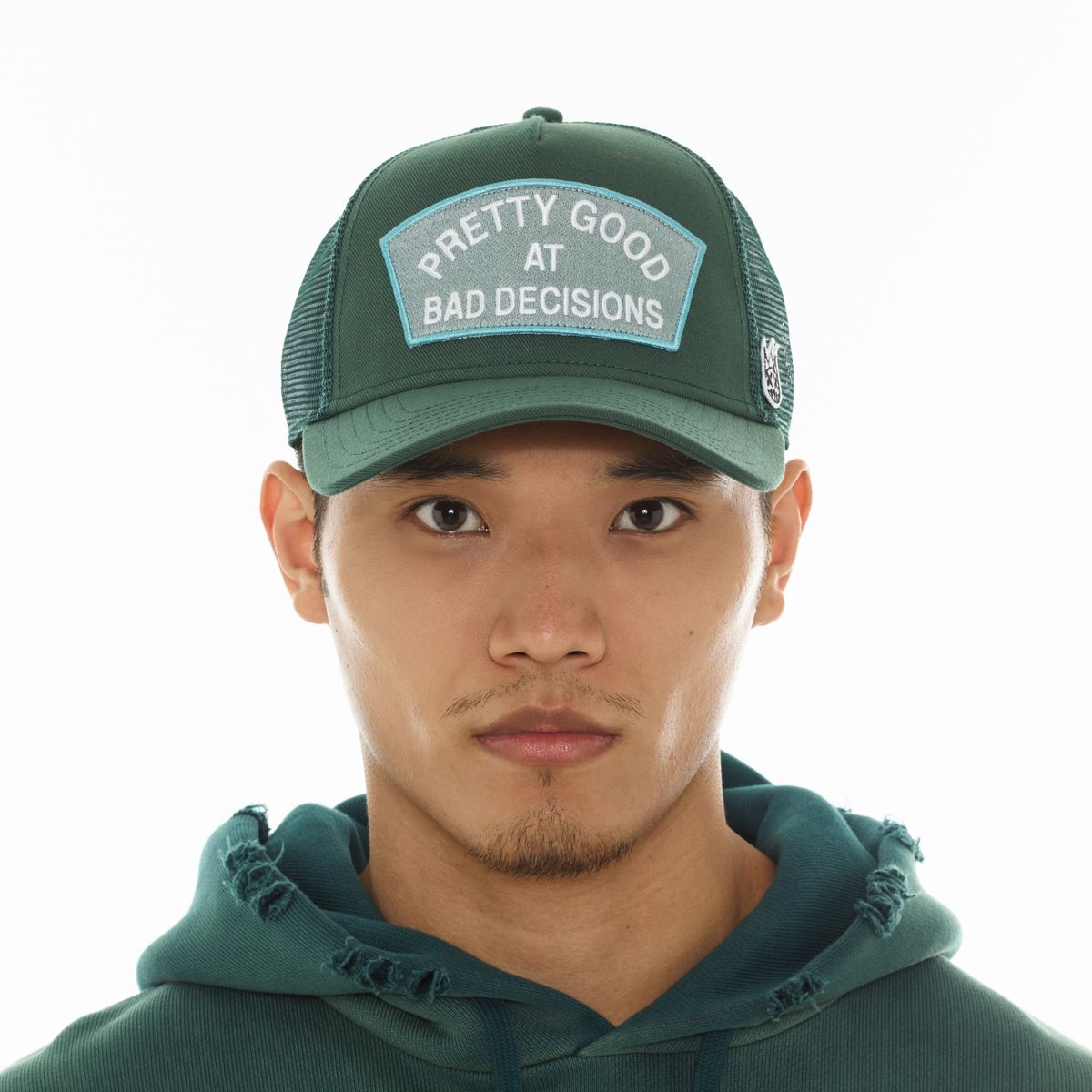 CULT MESH TRUCKER HAT "GOOD AT BAD DECISIONS" (BAYBERRY)