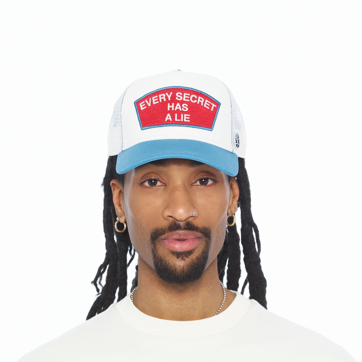 CULT MESH BACK TRUCKER CURVED VISOR " EVERY SECERT HAS A LIE " (WINTER WHITE)
